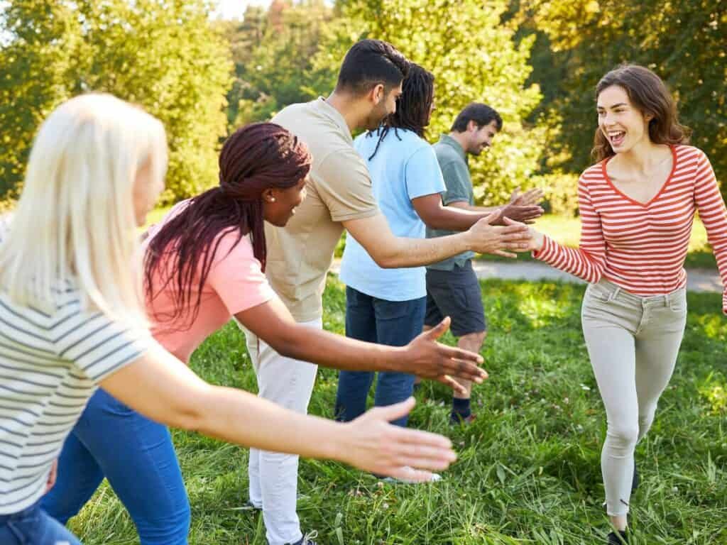 a group of people in a grassy area