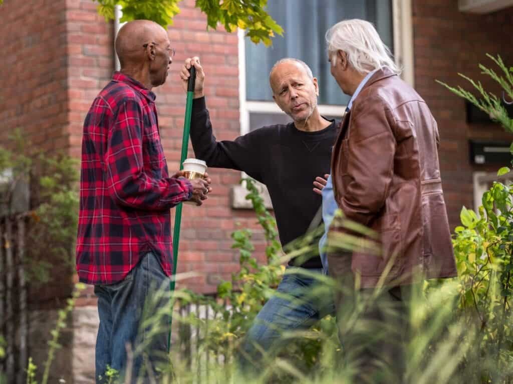 a group of men standing outside a building