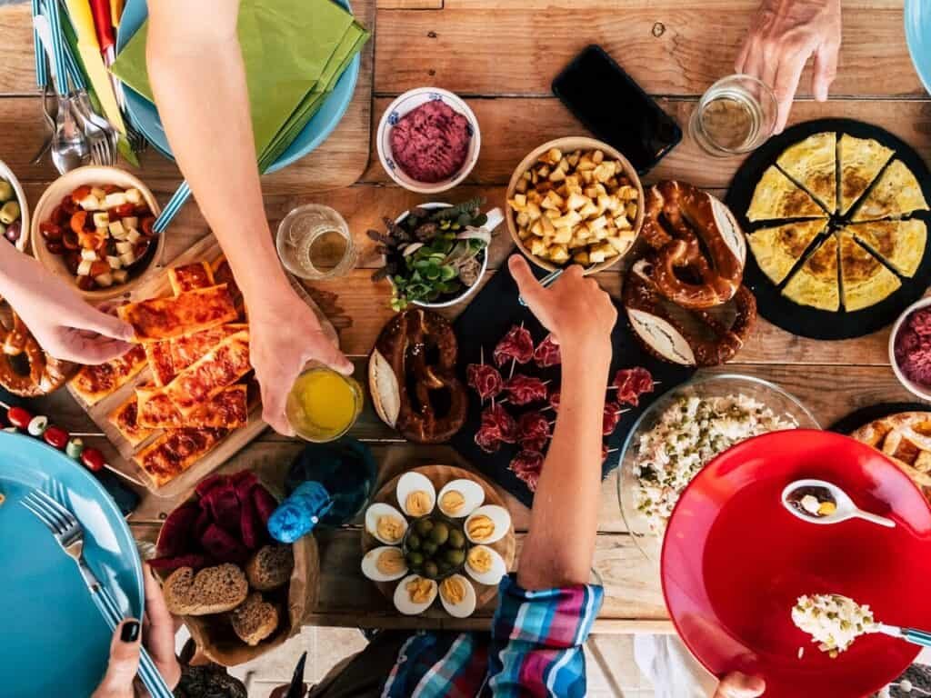 a group of people eating food on a table